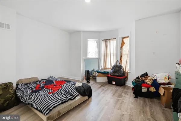 a bedroom with furniture and a couch