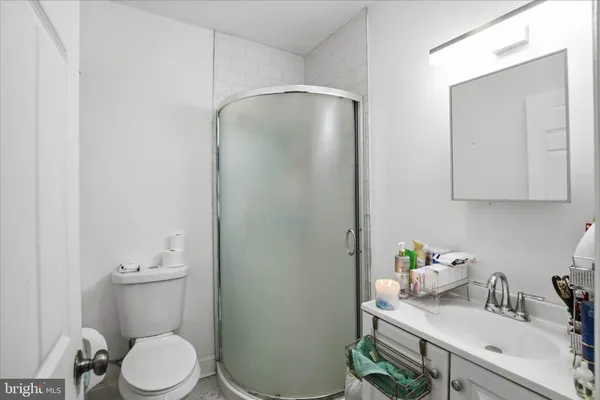 a bathroom with a sink toilet and vanity