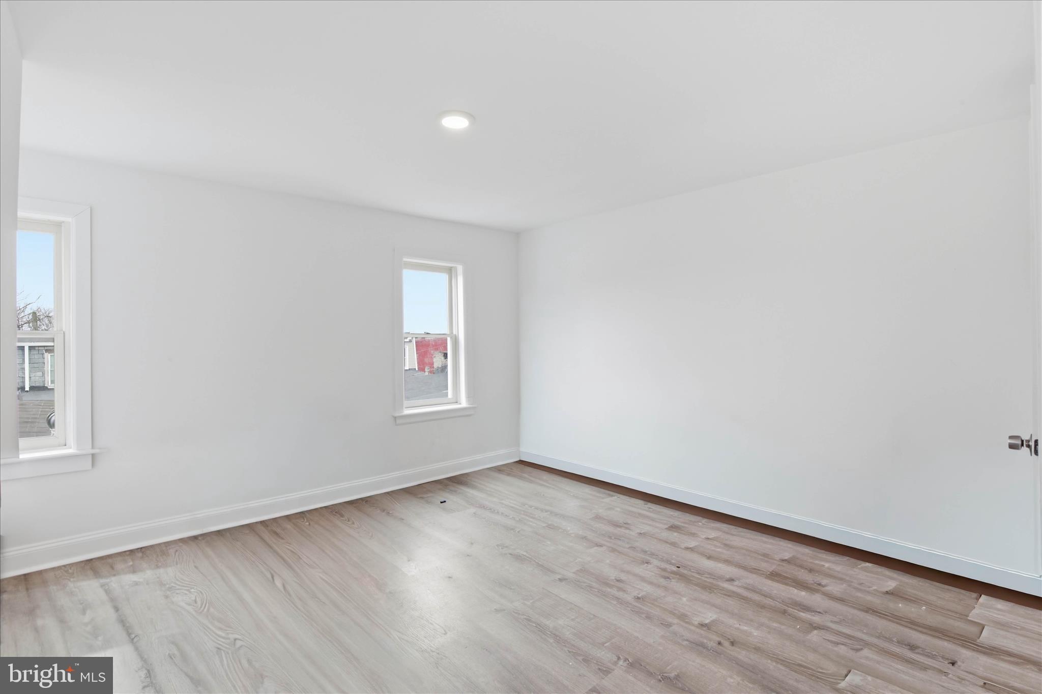 1910 North 3rd Street Harrisburg, PA 17102 - Photo 17 of 18 an empty room with wooden floor and window