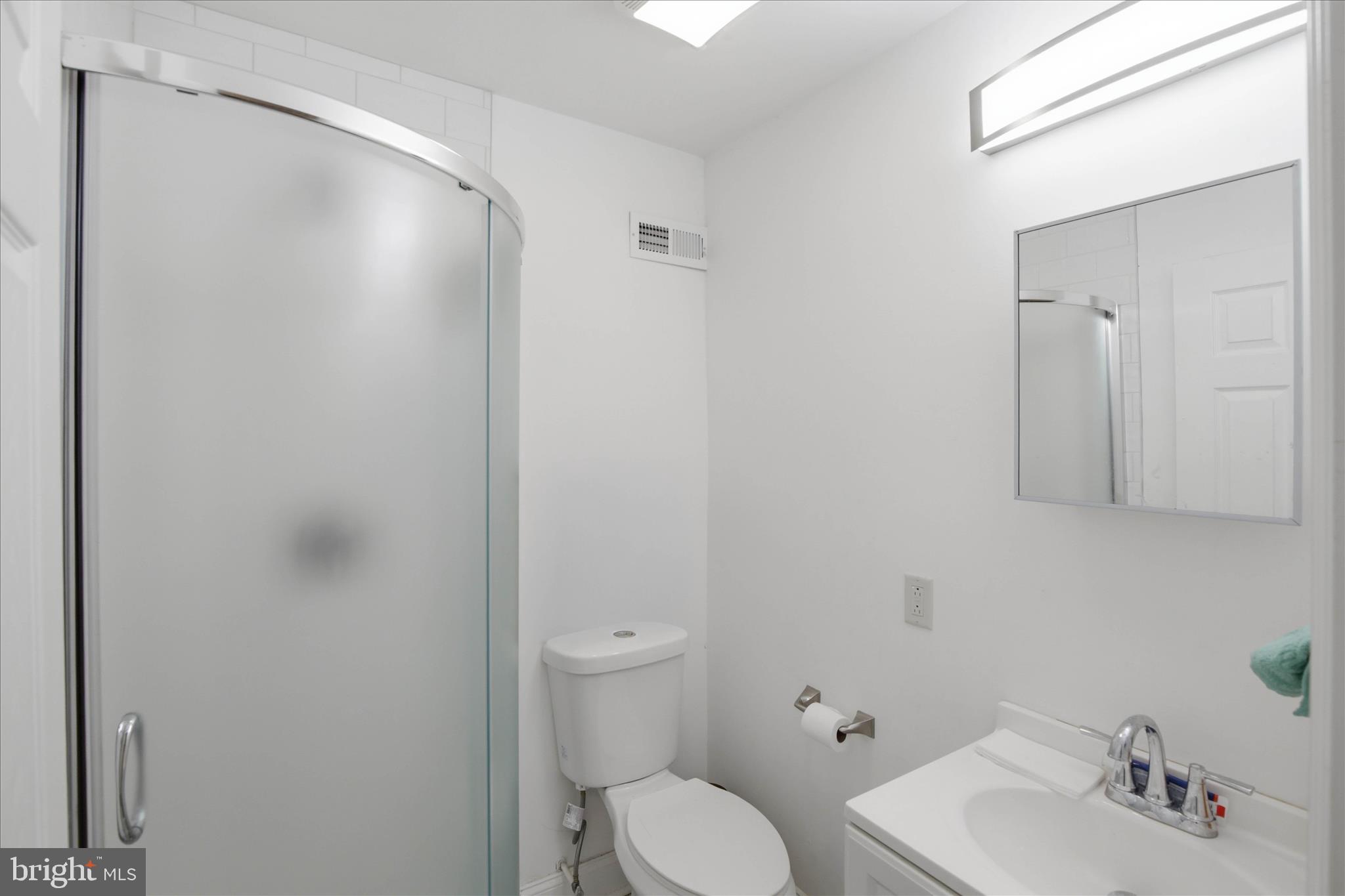 1910 North 3rd Street Harrisburg, PA 17102 - Photo 18 of 18 a bathroom with a toilet sink and mirror