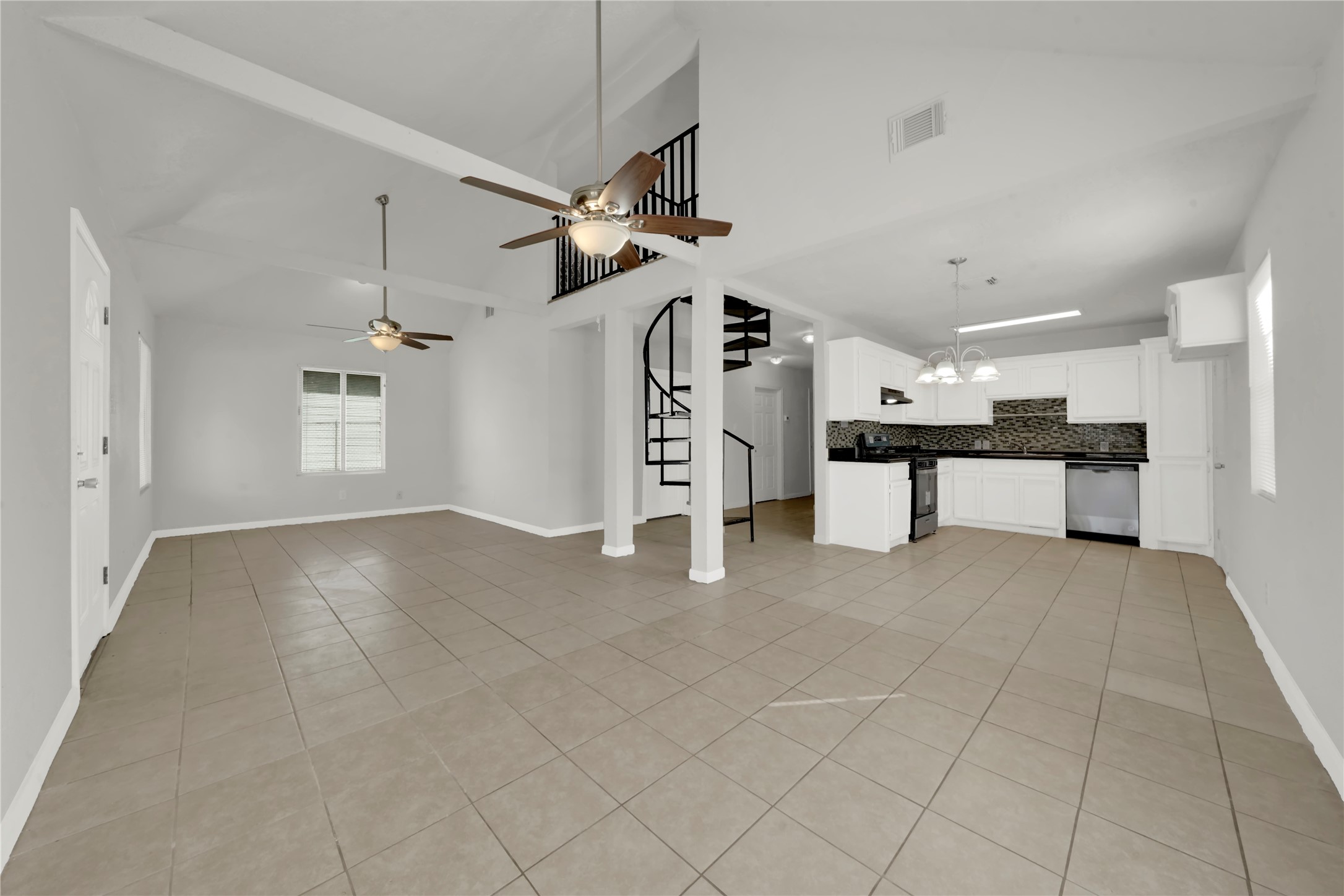 106 Hanover Street Houston, TX 77012 - Photo 7 of 49 a view of a livingroom with a furniture and chandelier fan
