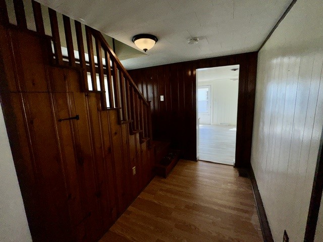 1701 West Jefferson Street Springfield, OH 45506 - Photo 9 of 18 This inviting entryway features rich wood paneling and elegant stairs, leading to spacious interiors.