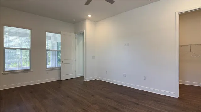 a view of an empty room and a window