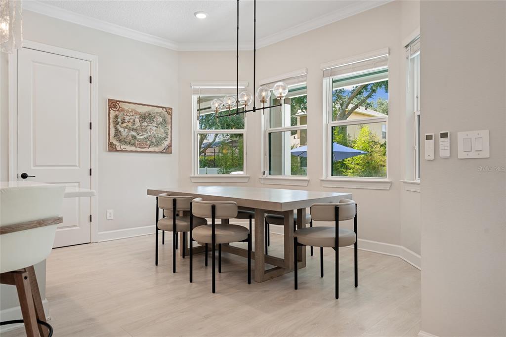 10175 Brocksport Circle Gotha, FL 34734 - Photo 14 of 54 a dining room with furniture and window