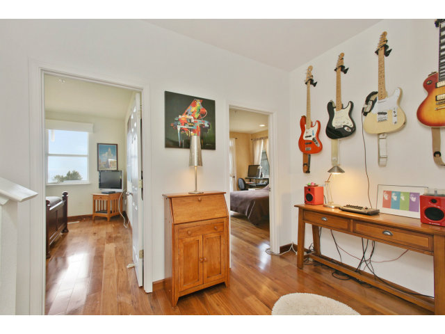 538 Monterey Road, Unit A Pacifica, CA 94044 - Photo 11 of 18 a living room with furniture and a wooden floor