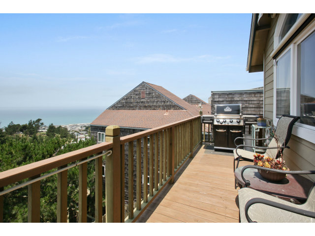 538 Monterey Road, Unit A Pacifica, CA 94044 - Photo 17 of 18 a view of a balcony with chair and iron stairs