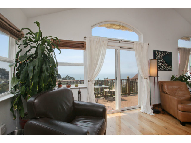 538 Monterey Road, Unit A Pacifica, CA 94044 - Photo 3 of 18 a living room with furniture and a floor to ceiling window