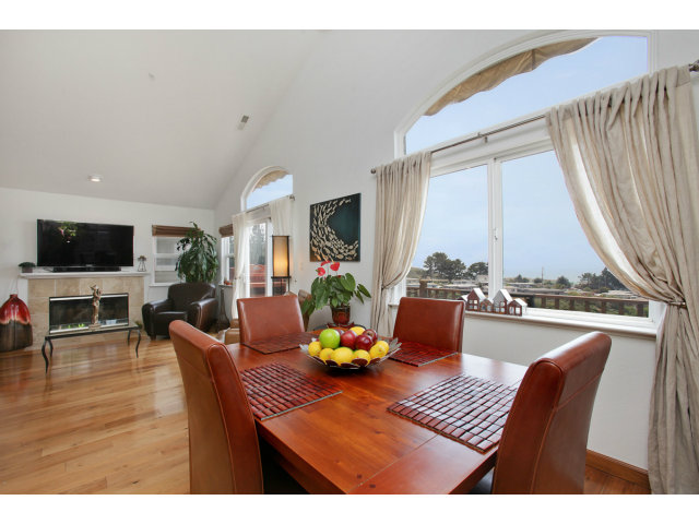 538 Monterey Road, Unit A Pacifica, CA 94044 - Photo 4 of 18 a view of a dining room with furniture window and wooden floor