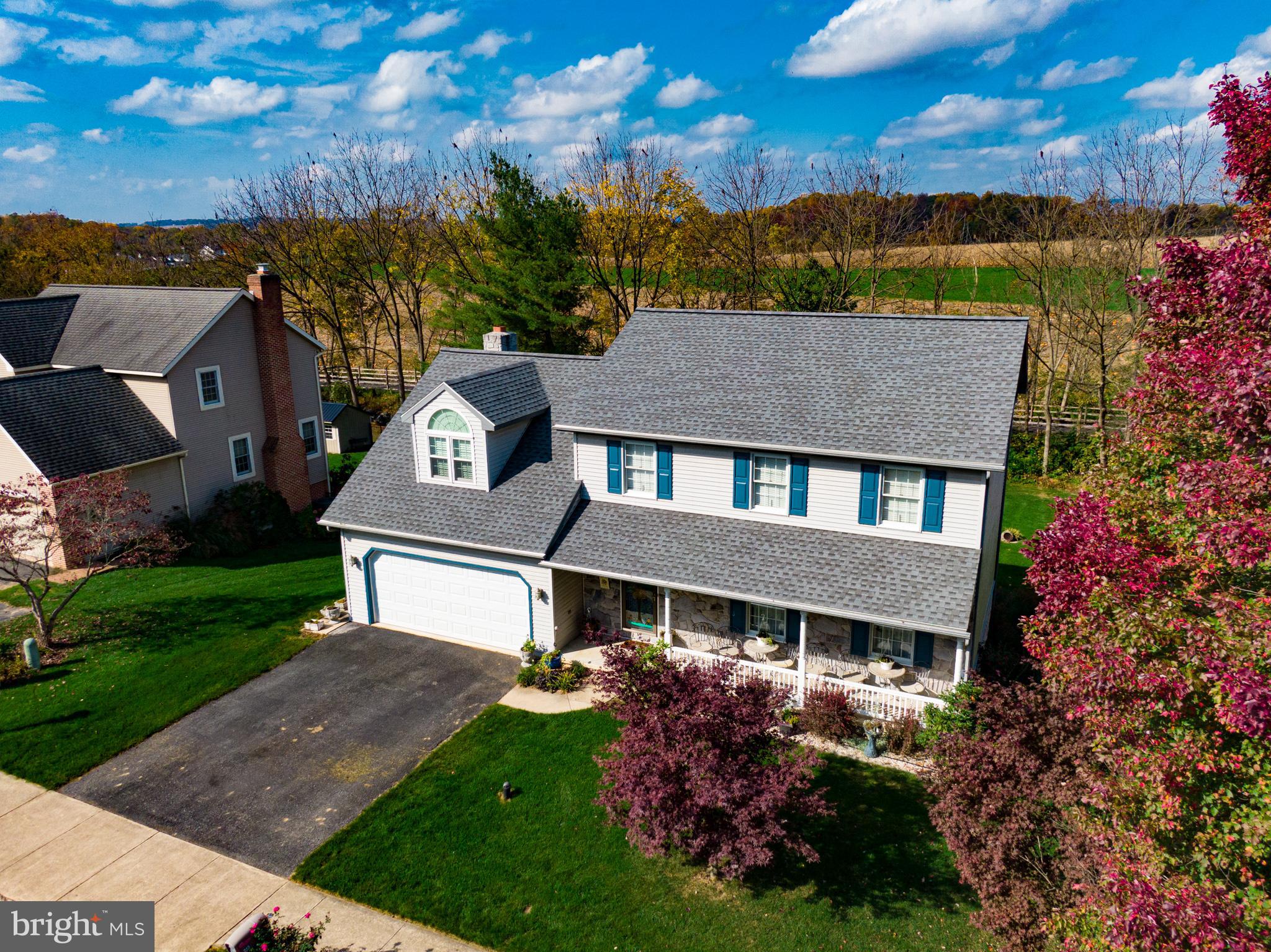 213 Bomberger Road Akron, PA 17501 - Photo 2 of 38 front view of a house with a yard