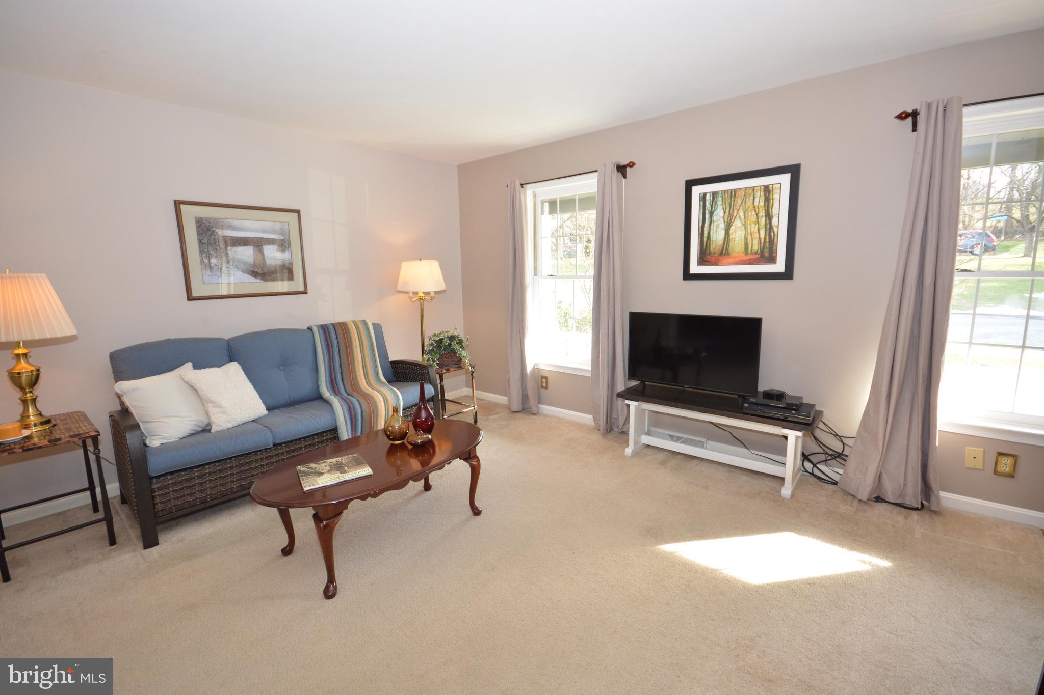 213 Bomberger Road Akron, PA 17501 - Photo 12 of 38 a living room with furniture and a flat screen tv