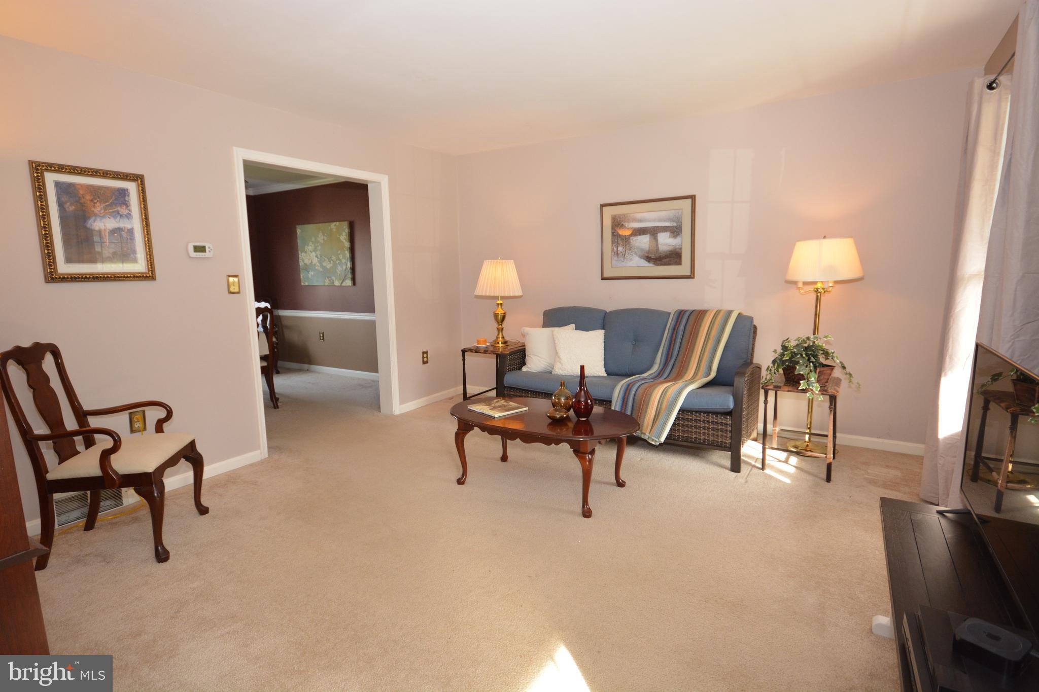 213 Bomberger Road Akron, PA 17501 - Photo 13 of 38 a living room with furniture and a flat screen tv