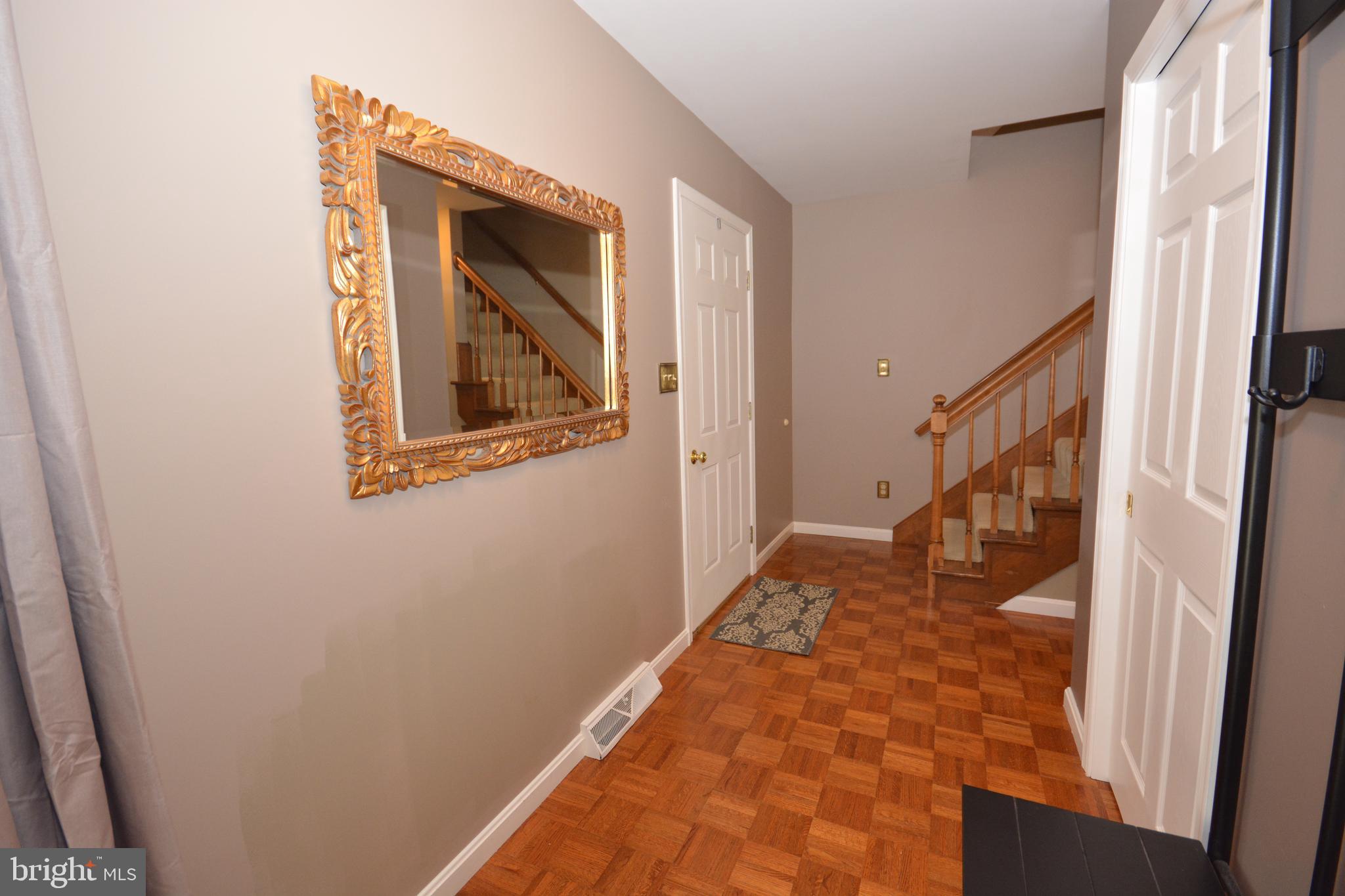 213 Bomberger Road Akron, PA 17501 - Photo 15 of 38 a view of a hallway with wooden floor and staircase
