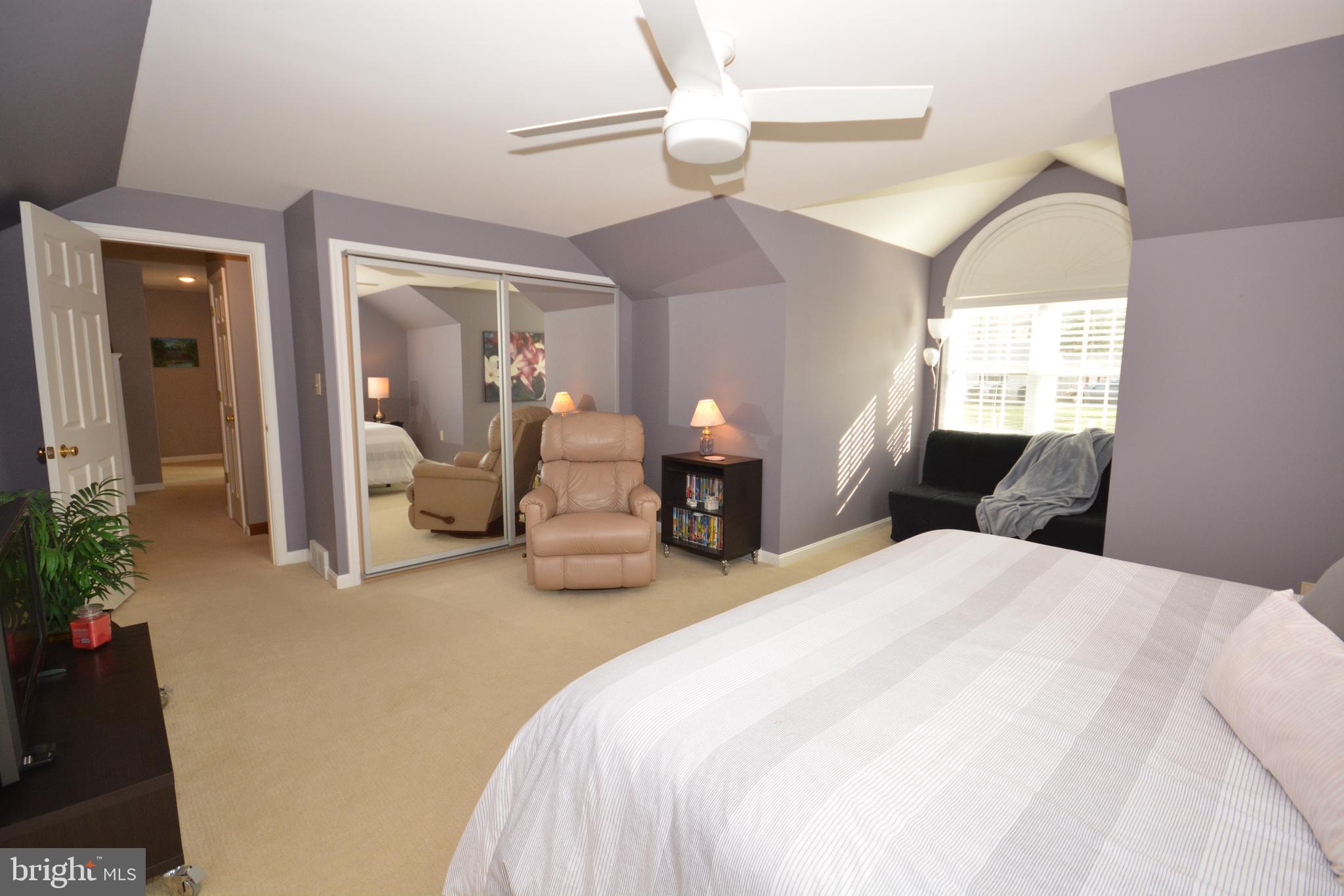 213 Bomberger Road Akron, PA 17501 - Photo 17 of 38 a bedroom with bed and a chandelier