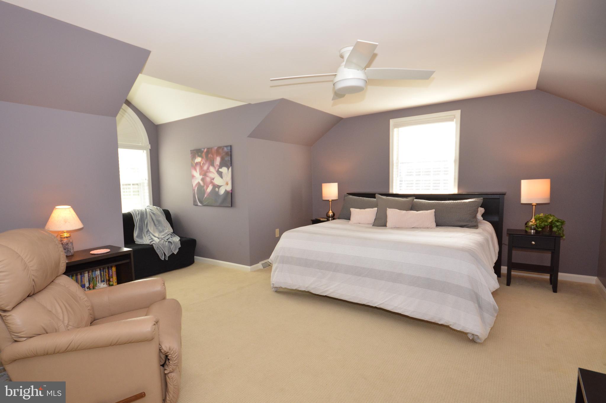 213 Bomberger Road Akron, PA 17501 - Photo 18 of 38 a bedroom with bed and a chandelier