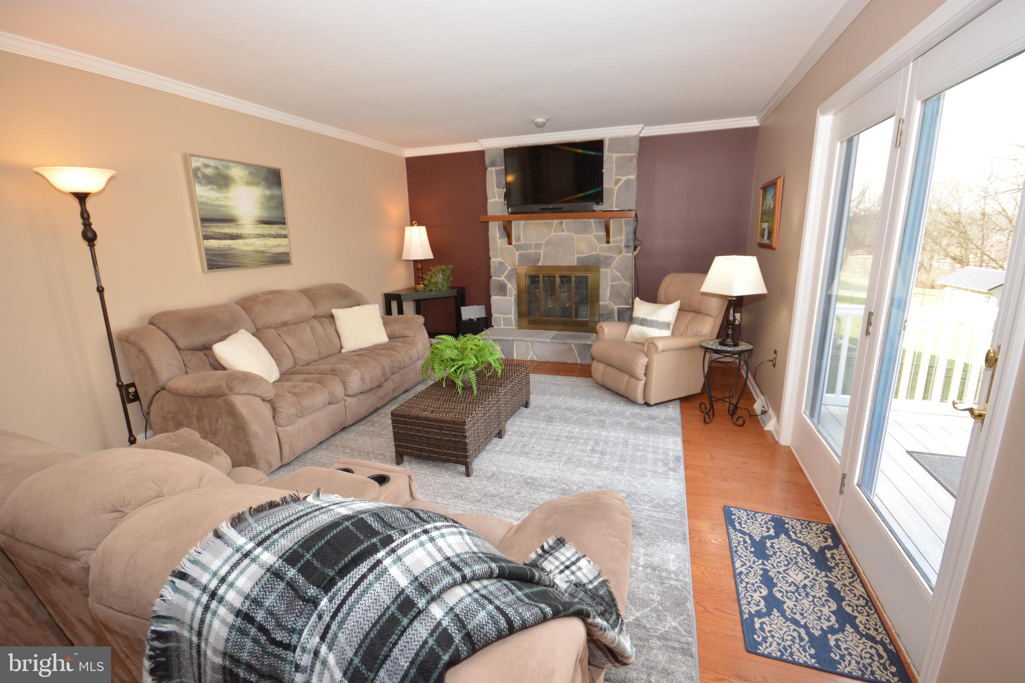 213 Bomberger Road Akron, PA 17501 - Photo 3 of 38 a living room with furniture and a flat screen tv