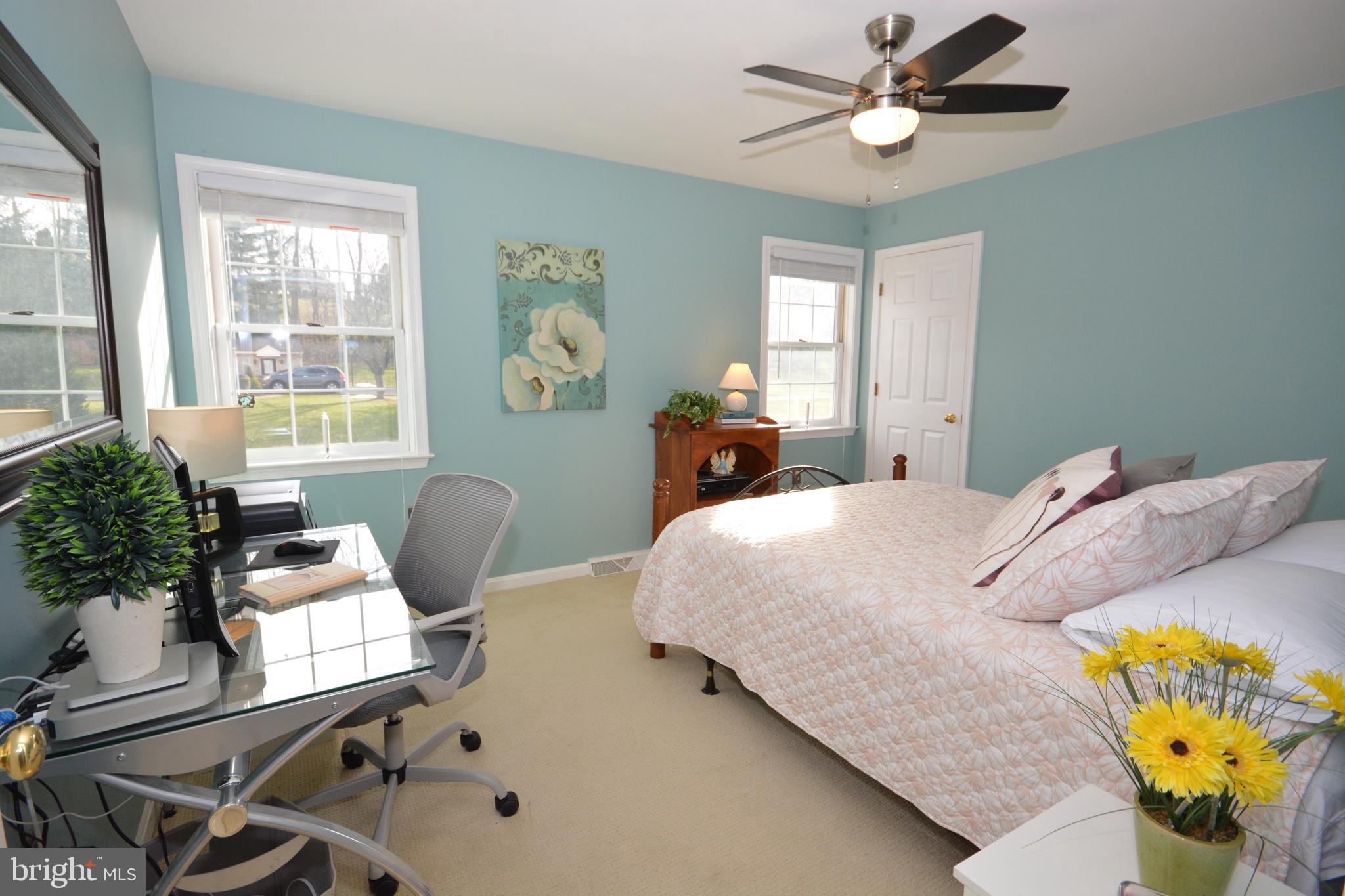 213 Bomberger Road Akron, PA 17501 - Photo 24 of 38 a bedroom with a bed and a chandelier