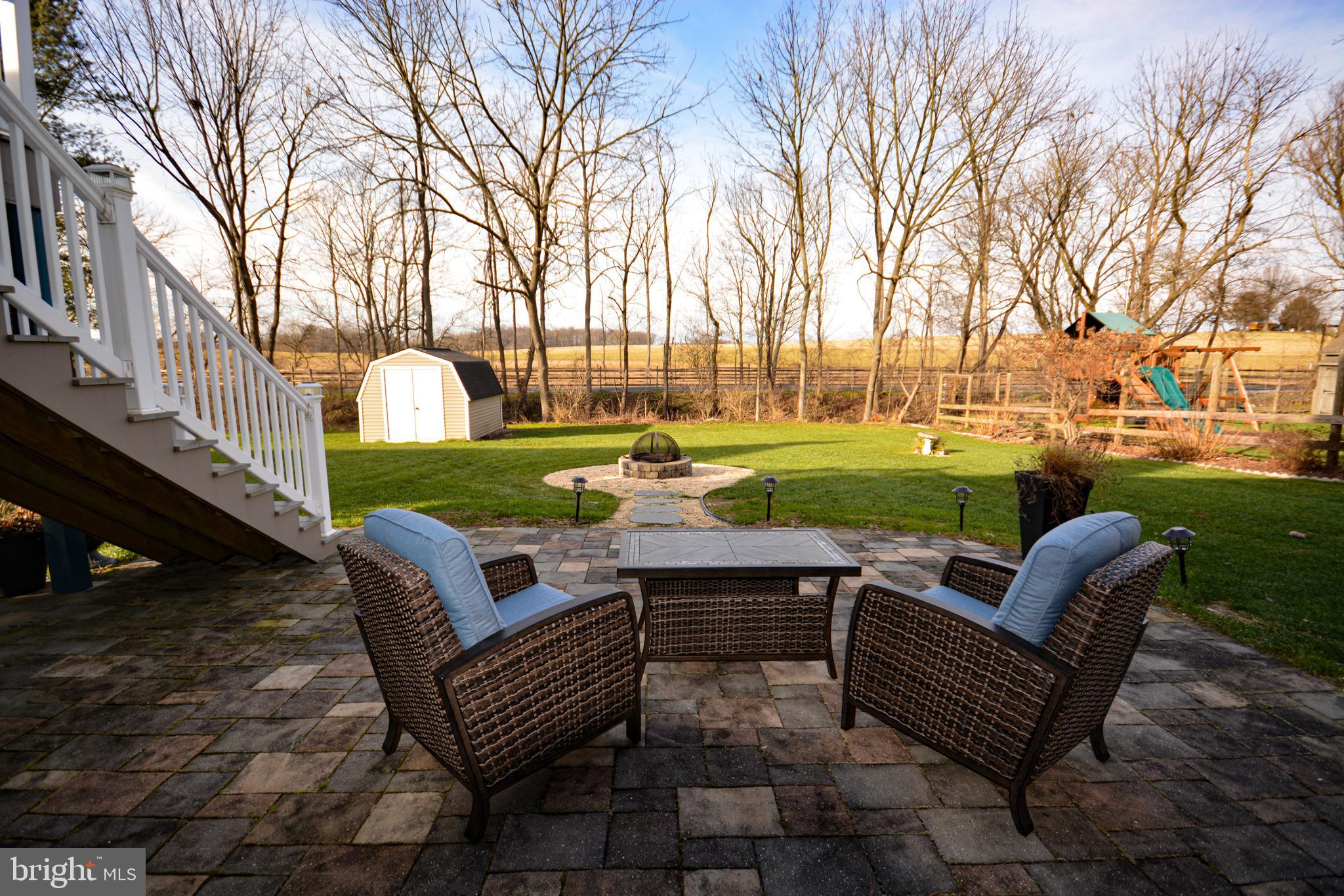 213 Bomberger Road Akron, PA 17501 - Photo 26 of 38 a view of a patio with couches and a fire pit
