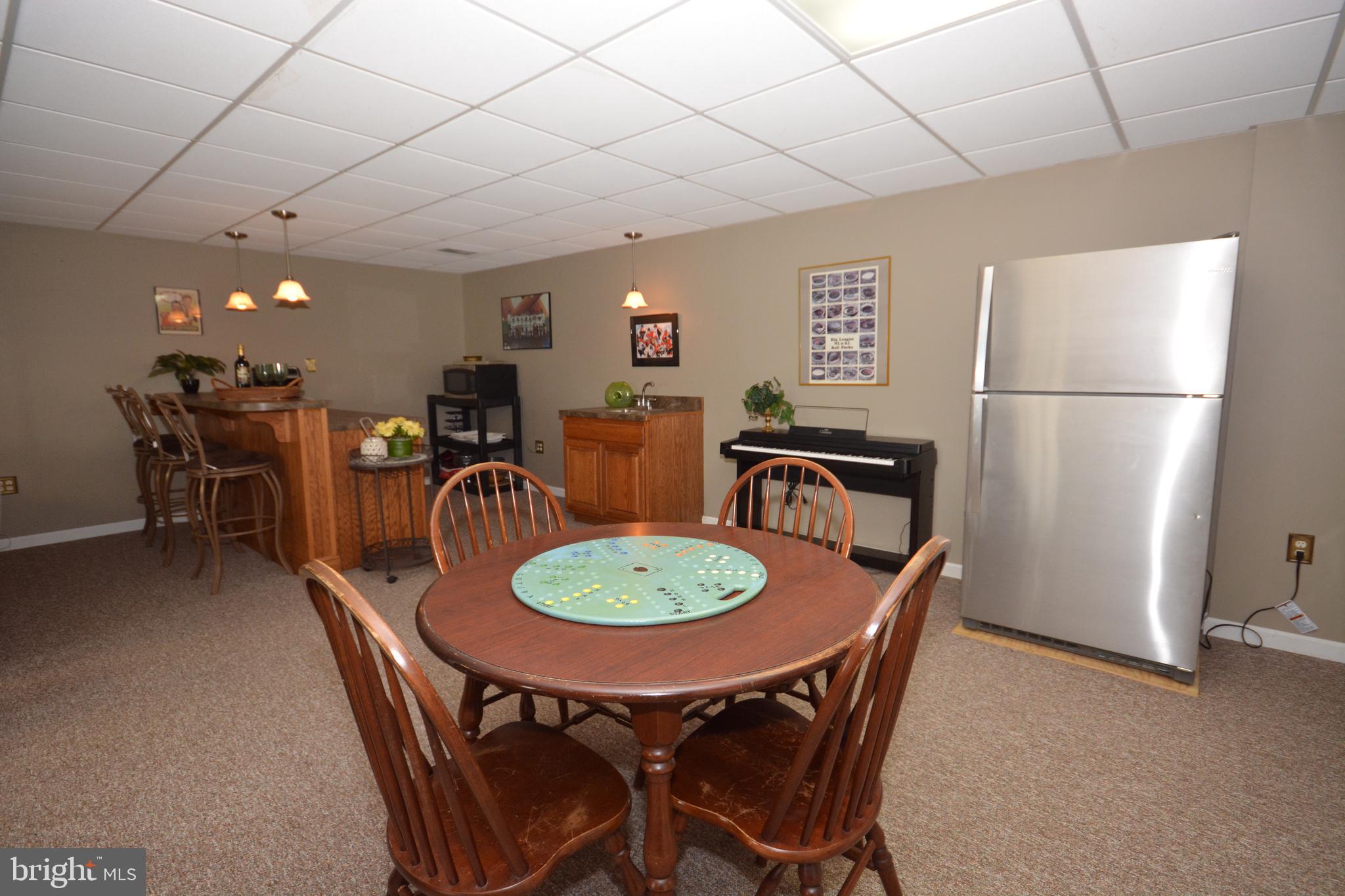 213 Bomberger Road Akron, PA 17501 - Photo 29 of 38 a dining room with furniture a window and kitchen view