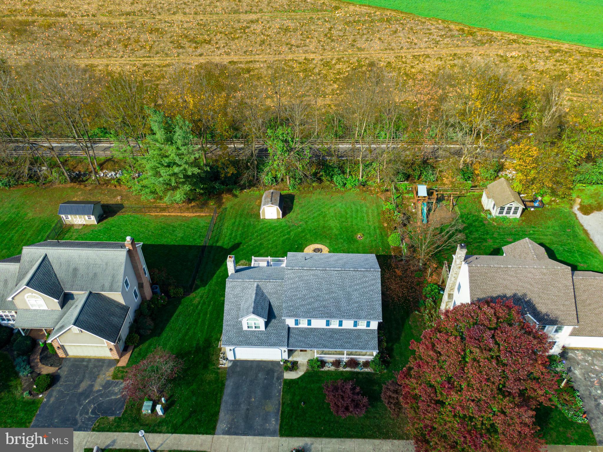 213 Bomberger Road Akron, PA 17501 - Photo 30 of 38 an aerial view of residential houses with outdoor space and trees