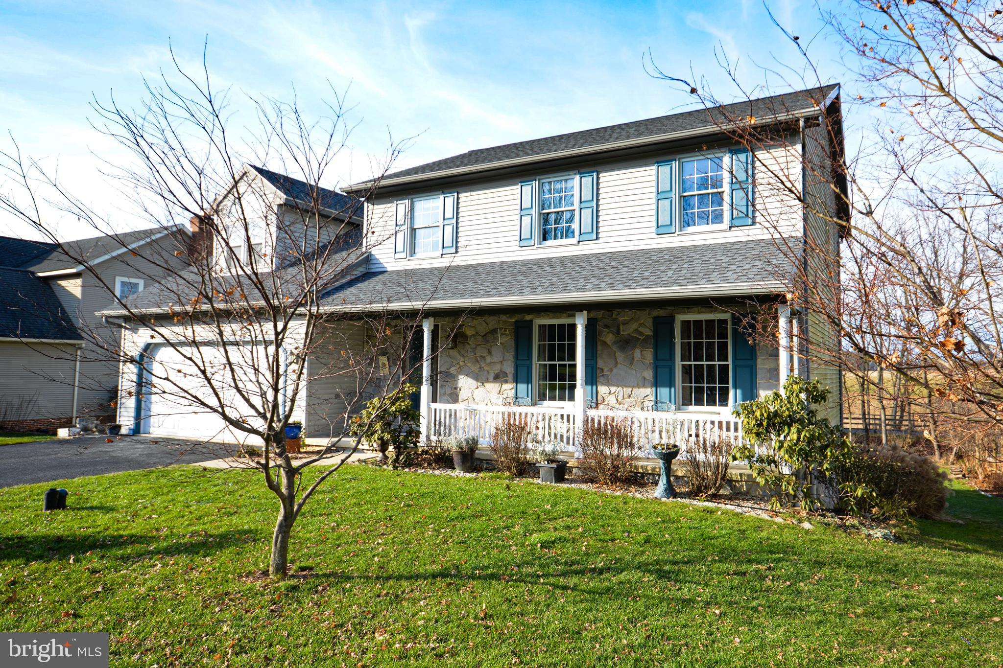 213 Bomberger Road Akron, PA 17501 - Photo 38 of 38 a front view of a house with garden