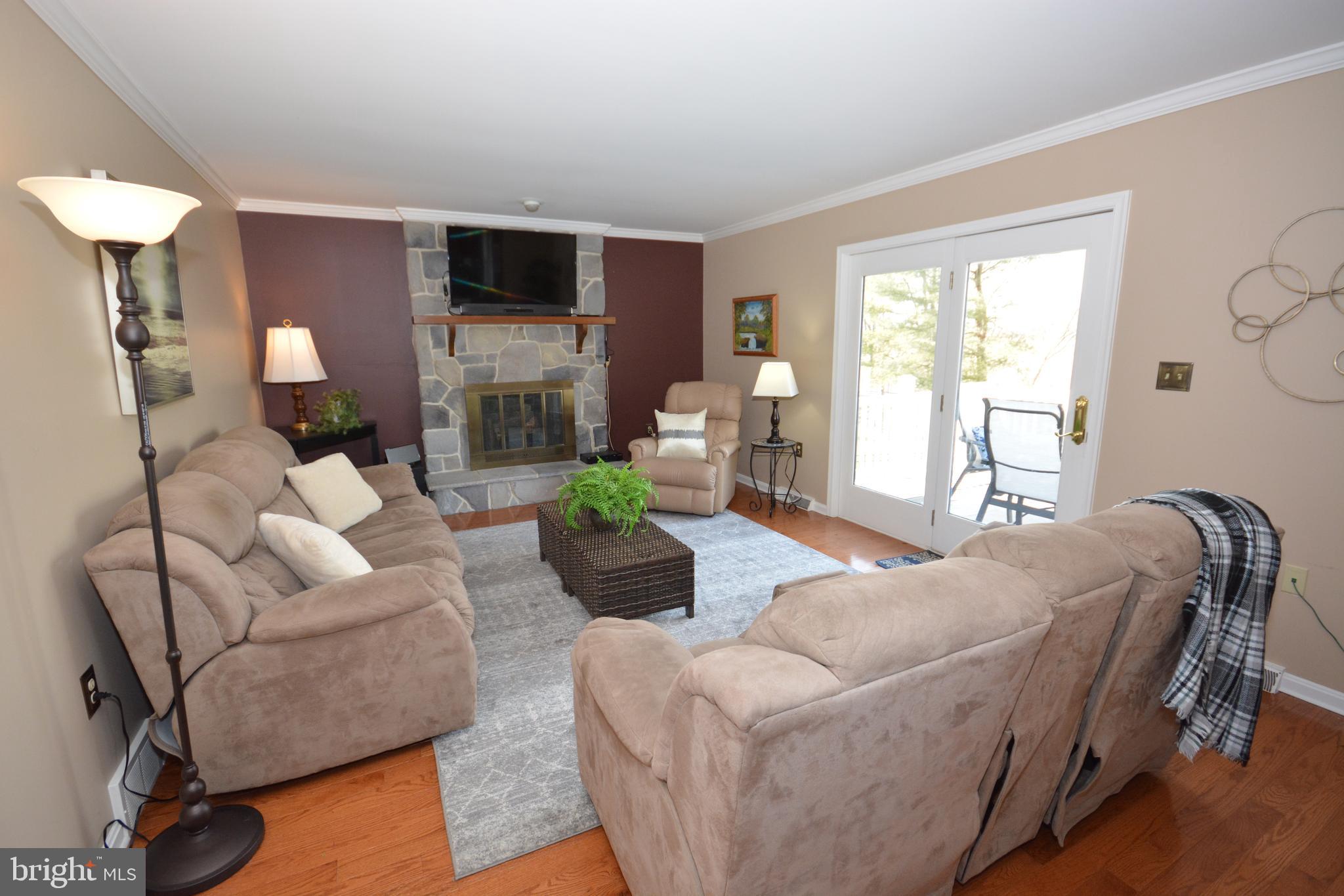 213 Bomberger Road Akron, PA 17501 - Photo 6 of 38 a living room with furniture and a flat screen tv