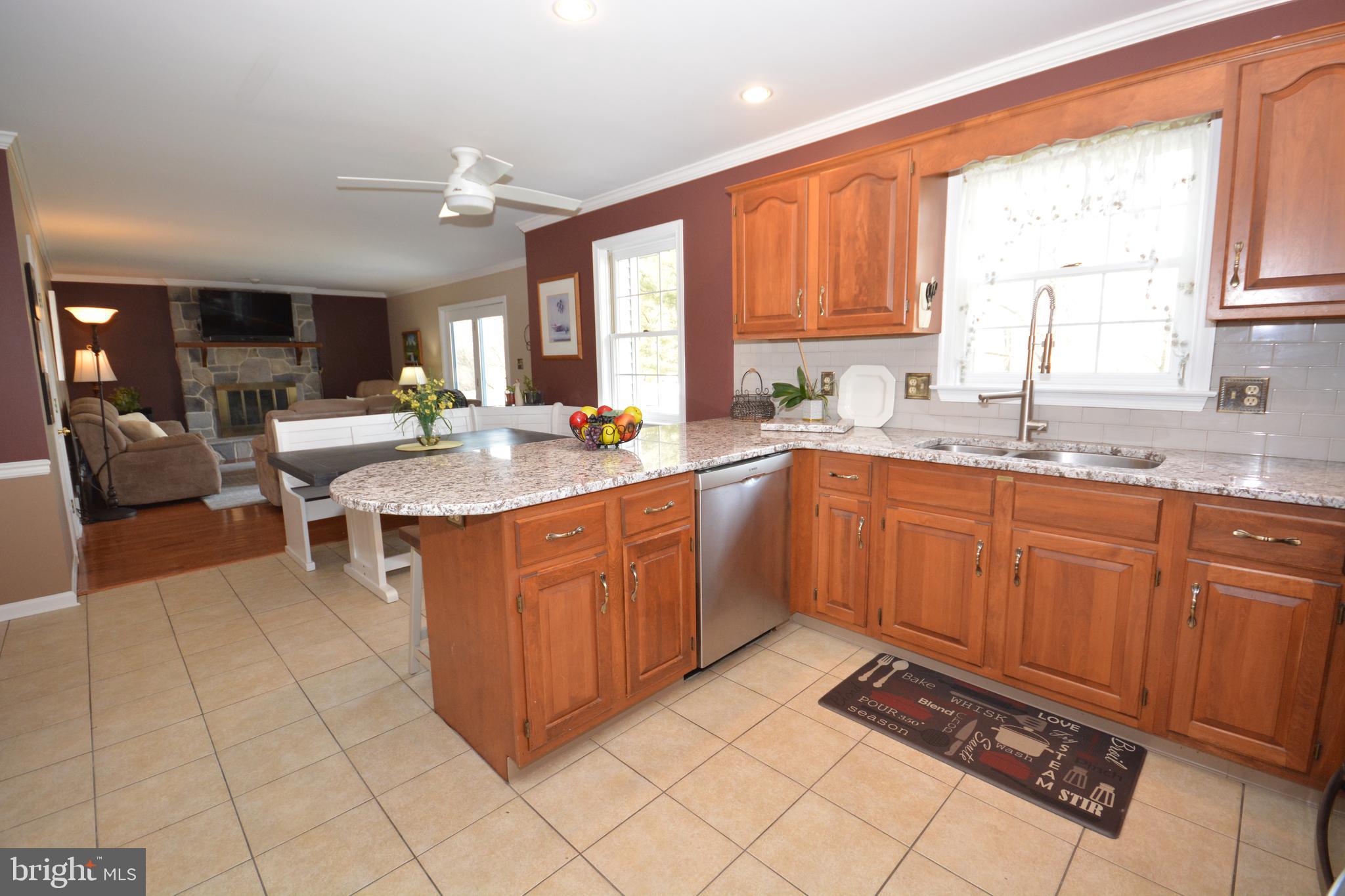 213 Bomberger Road Akron, PA 17501 - Photo 10 of 38 a kitchen with a sink stove and cabinets