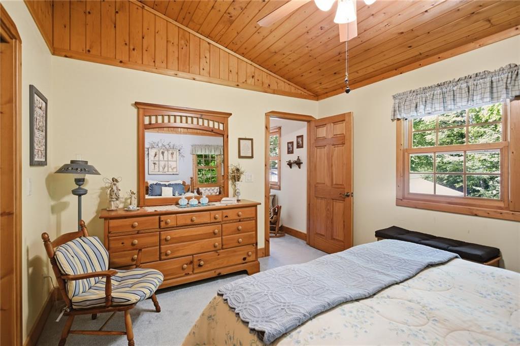 46 Spartan Lane Rabun Gap, GA 30568 - Photo 35 of 89 a bedroom with a bed and a dresser