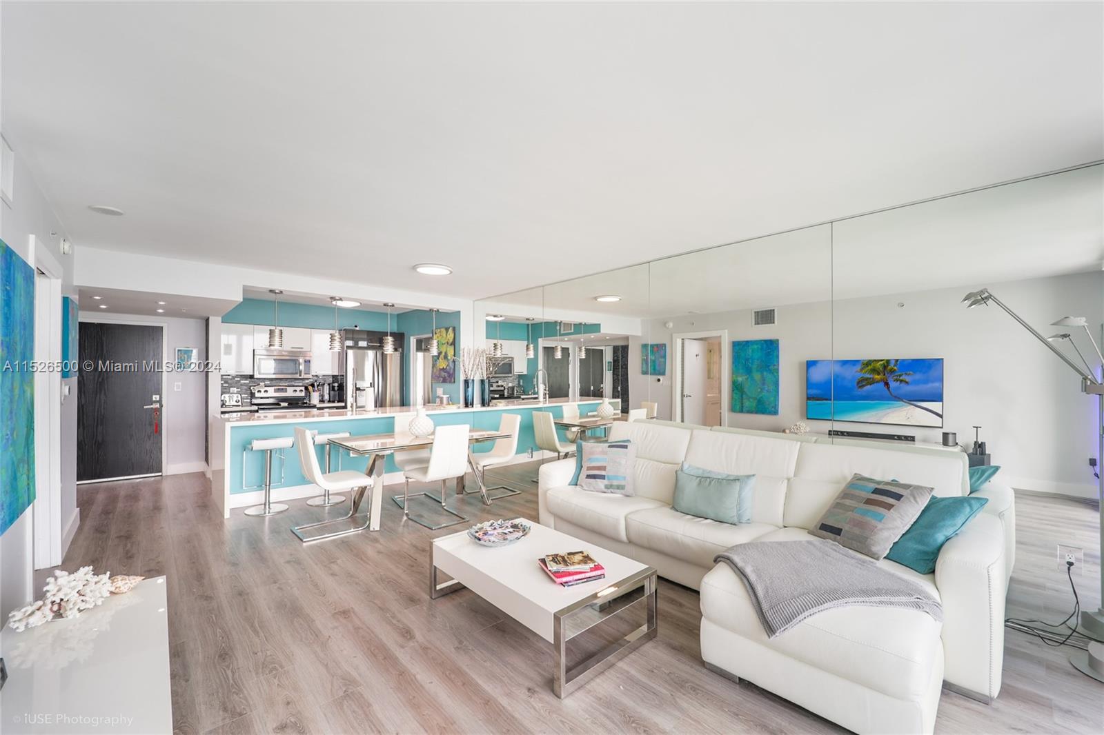 90 Alton Road, Unit 2806 Miami Beach, FL 33139 - Photo 2 of 18 a living room with furniture and a wooden floor