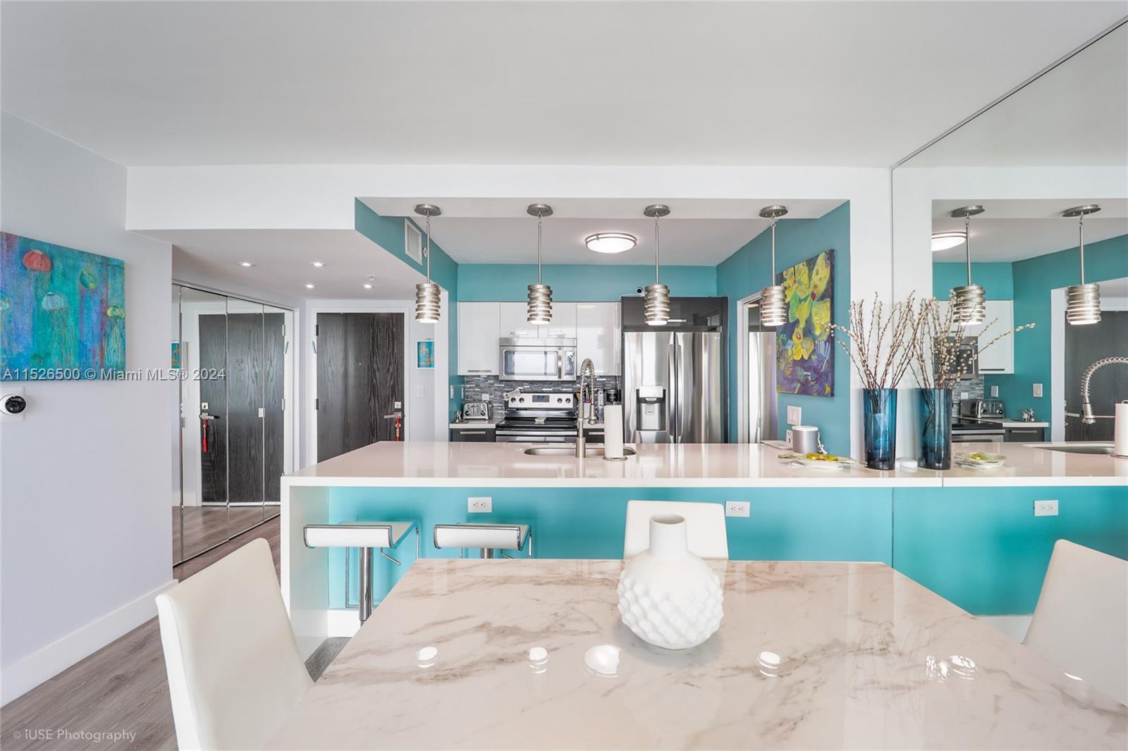 90 Alton Road, Unit 2806 Miami Beach, FL 33139 - Photo 10 of 18 a large white kitchen with a large window