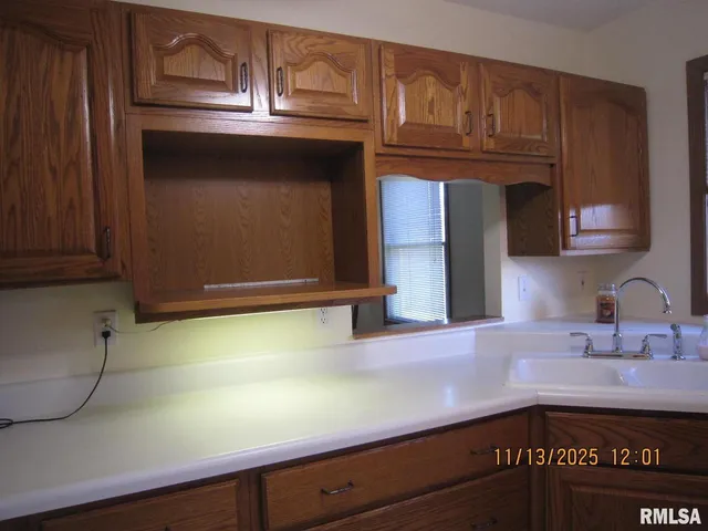 a kitchen with a stove and a microwave