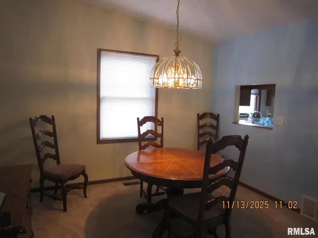 a room with a chandelier furniture and a chandelier