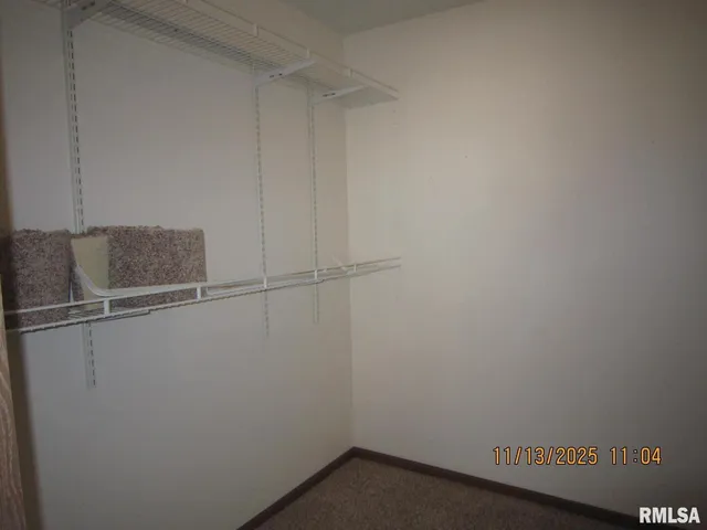 a bathroom with a sink vanity mirror and toilet