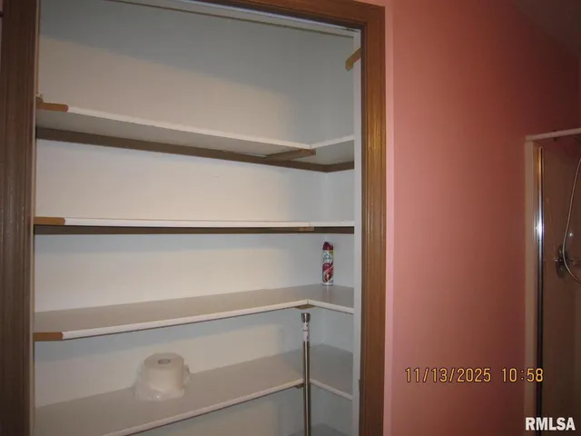 a bedroom with a bed and a closet