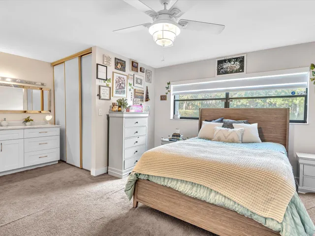 a view of a livingroom with furniture and a flat screen tv