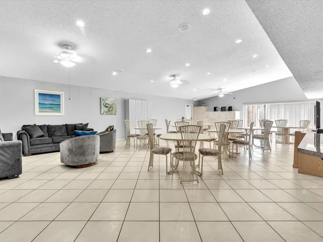 an aerial view of residential houses with yard