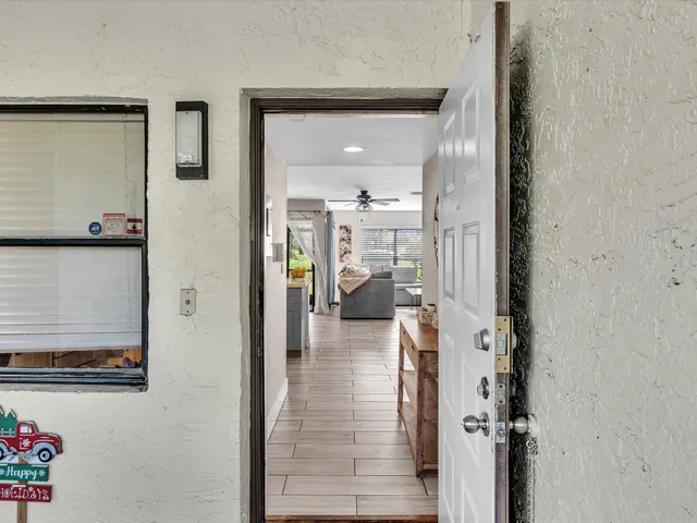 a kitchen with granite countertop a refrigerator and a sink