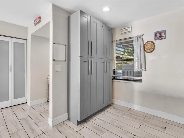 a kitchen with stainless steel appliances a refrigerator stove and microwave