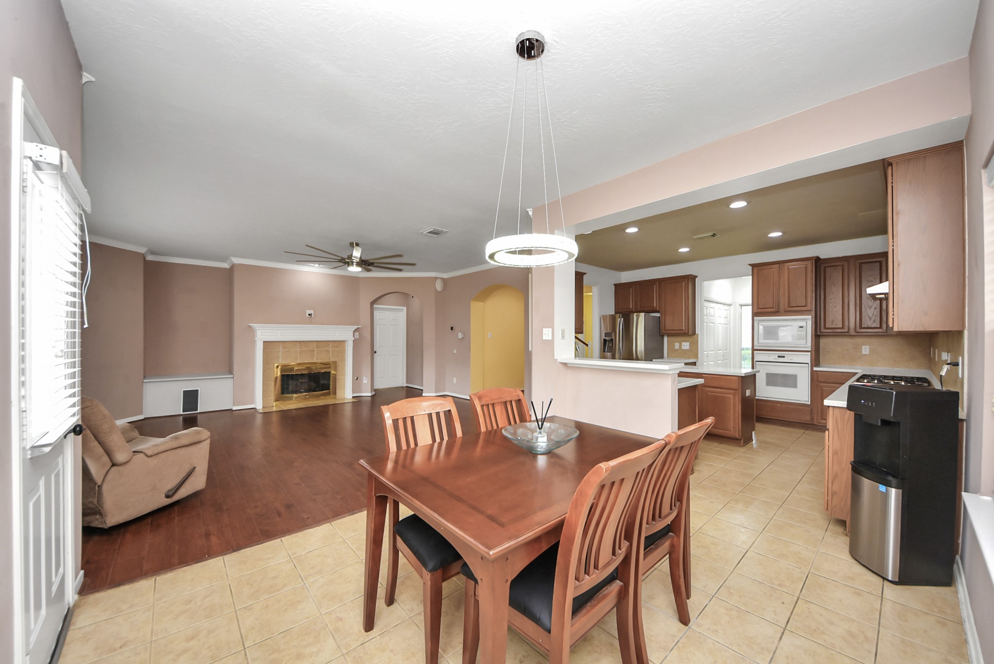 14103 Imperial Wood Lane Rosharon, TX 77583 - Photo 11 of 36 Seamless open-concept flow between kitchen and living areas