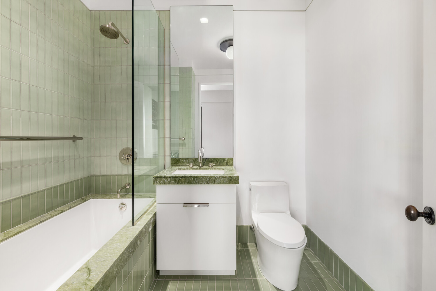 143 Reade Street, Unit 10A Manhattan, NY 10013 - Photo 11 of 18 a bathroom with a sink a toilet and shower