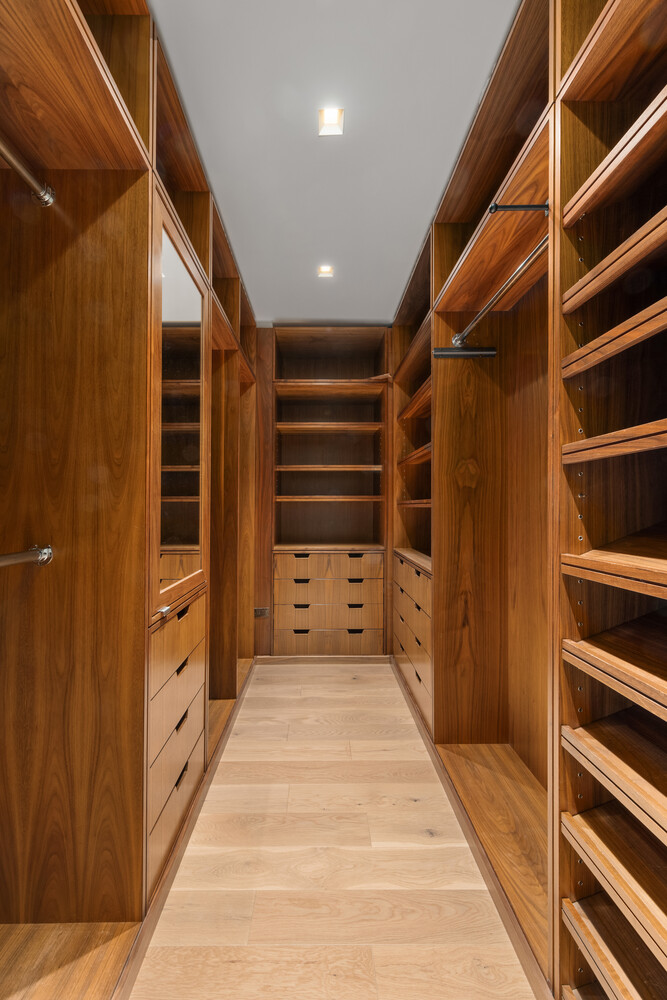 143 Reade Street, Unit 10A Manhattan, NY 10013 - Photo 6 of 18 a view of walk in closet with clothes and shoes