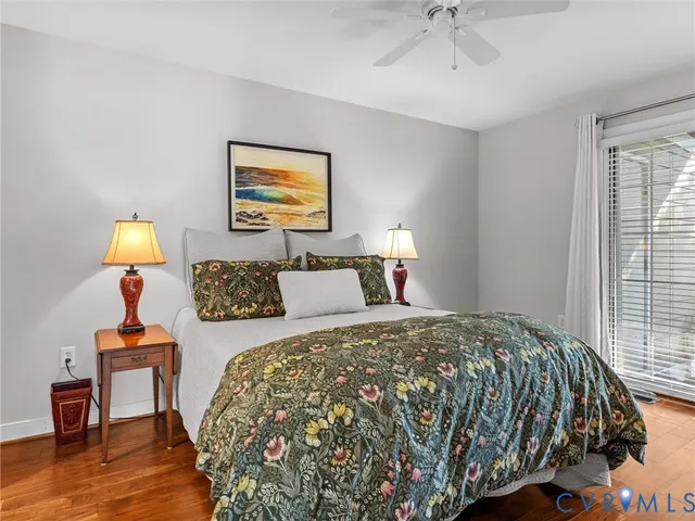 a bedroom with bed and a window