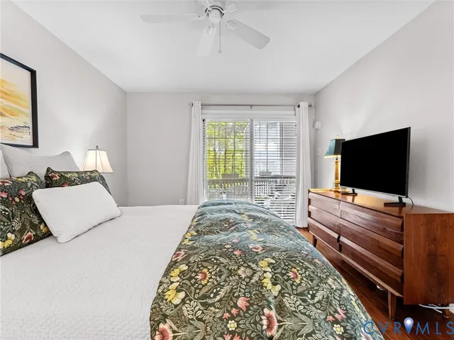 a bedroom with a bed and a flat screen television