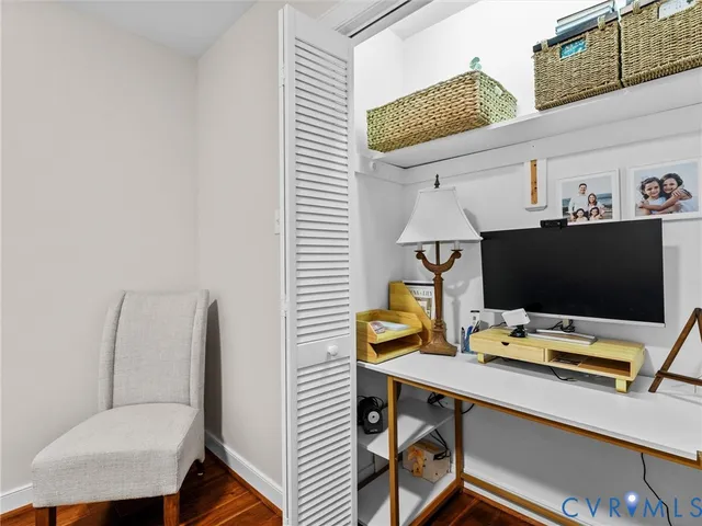 a view of a workspace with furniture