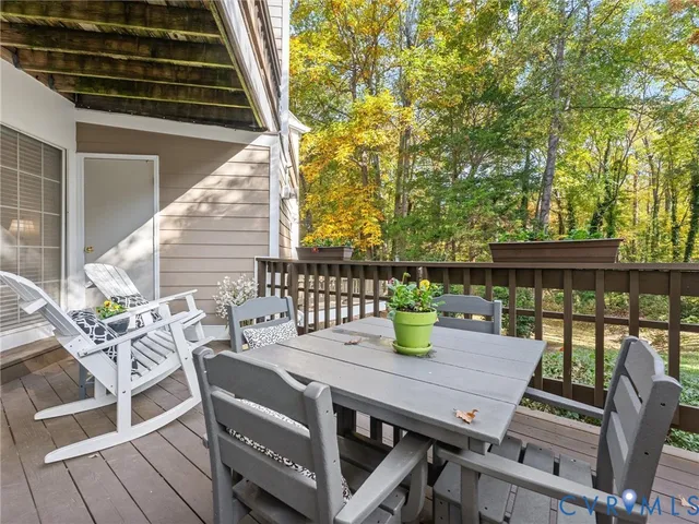 a view of an outside dining space with furniture