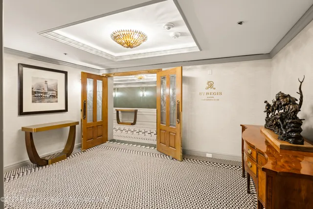 a bathroom with a sink a mirror and a shower