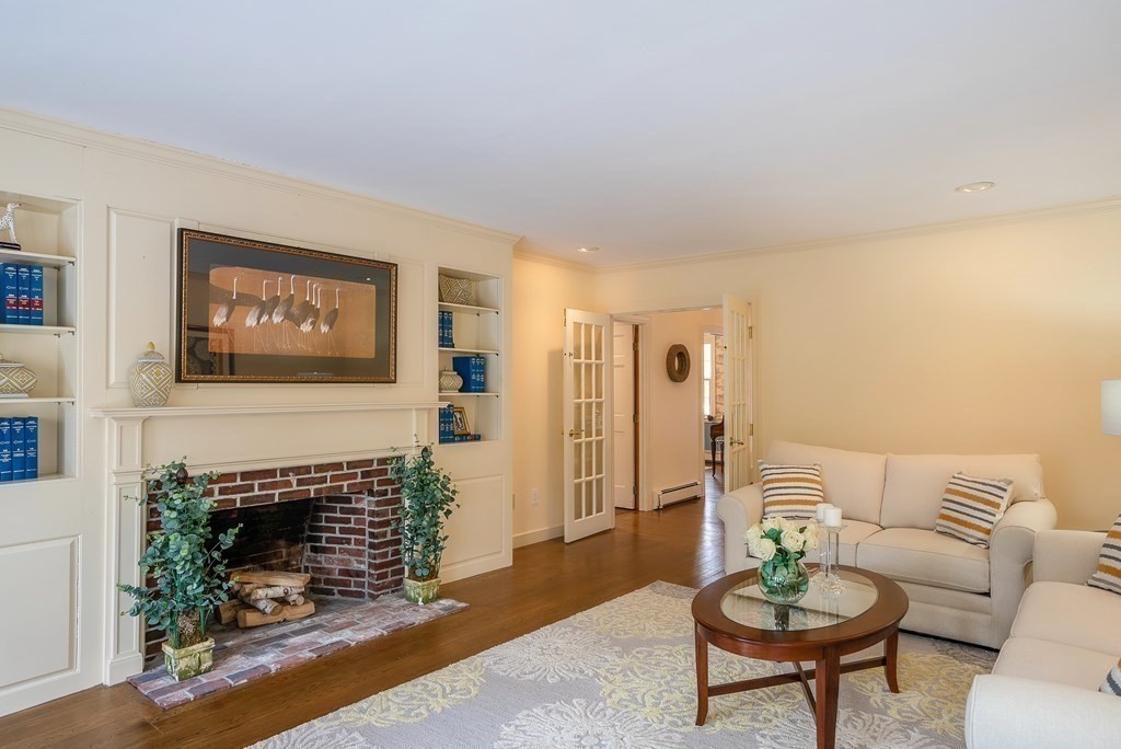 2 Sudbury Road Weston, MA 02493 - Photo 12 of 42 a living room with furniture and a fireplace