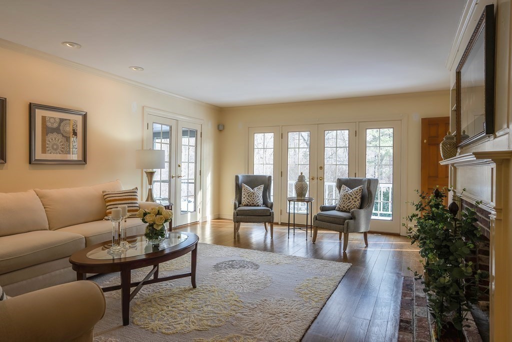 2 Sudbury Road Weston, MA 02493 - Photo 13 of 42 a living room with furniture wooden floor and a flat screen tv