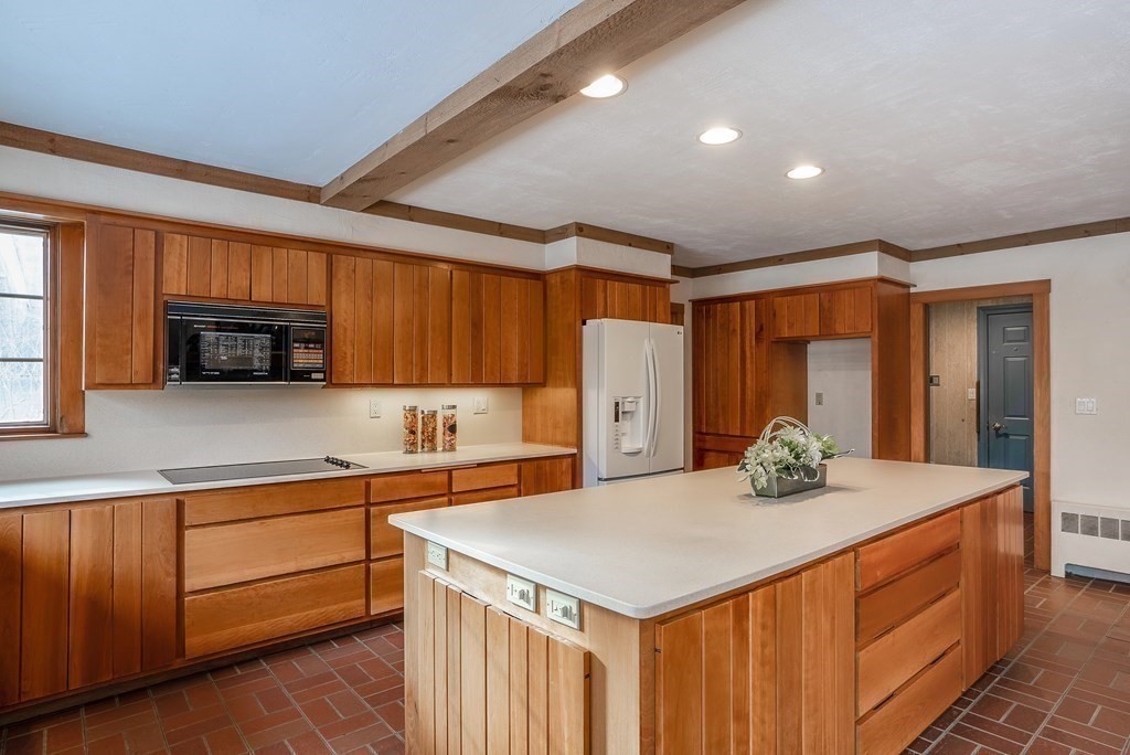 2 Sudbury Road Weston, MA 02493 - Photo 14 of 42 a kitchen with stainless steel appliances a sink stove and cabinets
