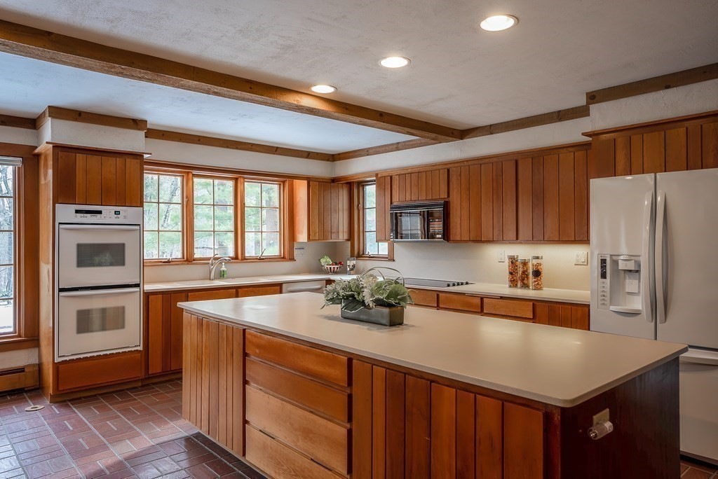 2 Sudbury Road Weston, MA 02493 - Photo 15 of 42 a kitchen with stainless steel appliances a sink a stove and a refrigerator