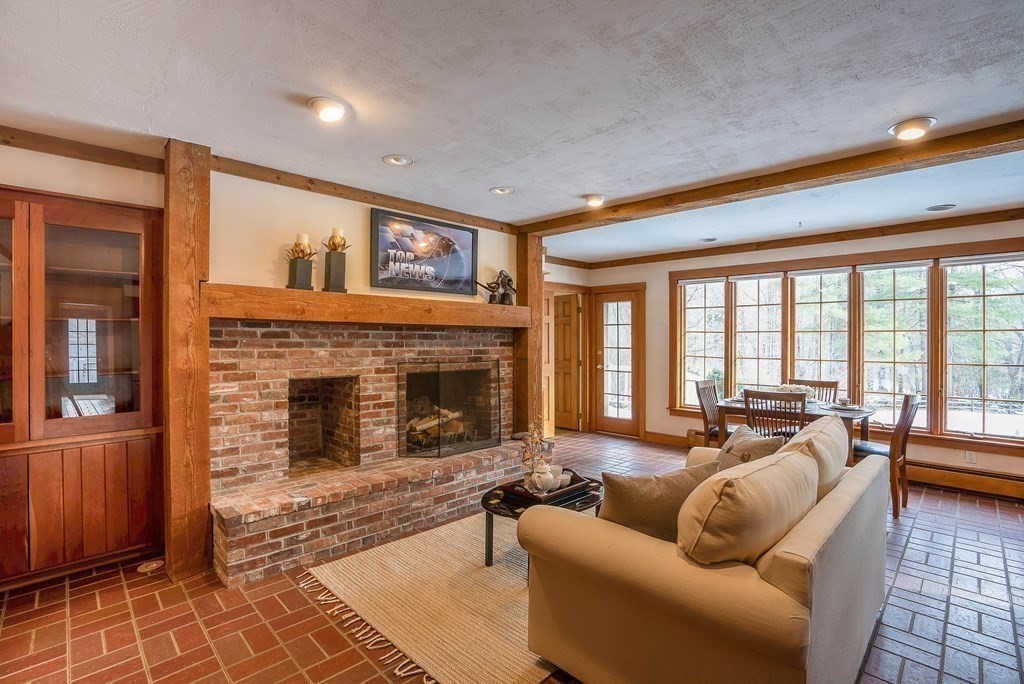 2 Sudbury Road Weston, MA 02493 - Photo 18 of 42 a living room with furniture and a fireplace